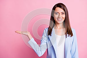 Photo of young beautiful happy smiling positive businesswoman hold hand demonstrate isolated on pink color background