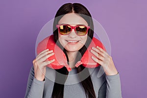 Photo of young cheerful girl eyewear neck pillow trip holiday flight isolated over purple color background