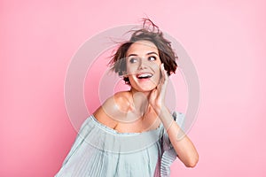 Photo of young cheerful girl happy positive smile dream look empty space isolated over pastel color background