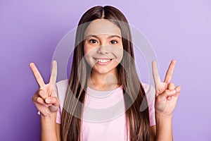 Photo of young cheerful girl happy positive smile show peace cool v-sign isolated over violet color background