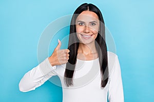 Photo of young cheerful lady show thumb-up ads approve perfect suggest isolated over blue color background