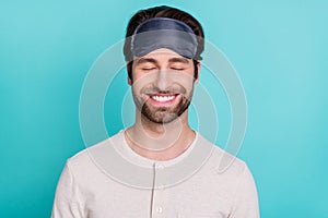 Photo of young cheerful man happy positive smile daydream rest relax isolated over turquoise color background