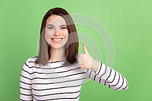 Photo of young cheerful woman show thumb-up like advertise great ideal isolated over green color background