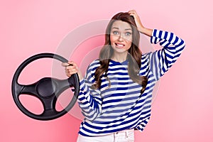 Photo of young confused unhappy girl hand head staring stupor hold steering wheel breakdown broken car isolated on pink