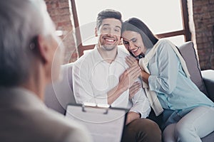 Photo of young couple cuddle sit couch appointment psychotherapist loft interior office indoors