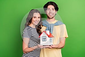Photo of young couple happy positive smile buy home accommodation credit isolated over green color background