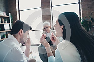 Photo of young couple talk argue appointment psychotherapist loft interior office indoors