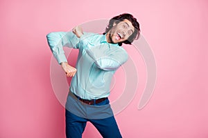 Photo of young crazy energetic handsome man smile have fun dance enjoy party isolated over pink color background