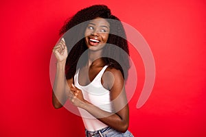 Photo of young excited african girl happy positive smile have fun dance isolated over red color background