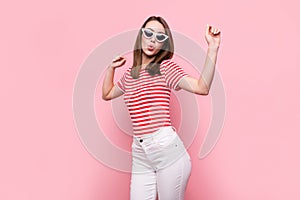 Photo of young excited girl happy positive smile have fun dance wear sunglass isolated over pink color background