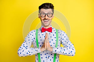 Photo of young excited man happy positive smile excited expect wait dream ask isolated over yellow color background