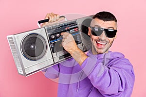 Photo of young excited man make louder music party discotheque eyeglasses isolated over pink color background