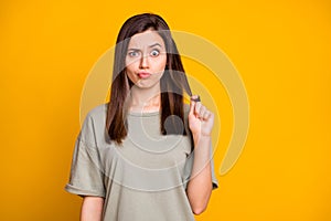 Photo of young funky funny uncertain shocked skeptic unsure girl pout lips pull hair isolated on yellow color background