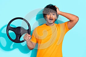 Photo of young funny driver indian man holding steering wheel automobile traffic crash accident breakdown isolated on