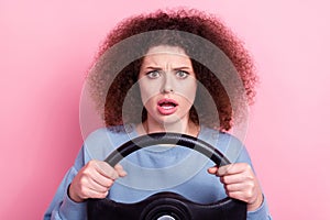 Photo of young funny excited woman breakdown road hold steering wheel stupor bad mood her car crashed isolated over pink