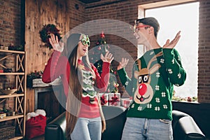 Photo of young funny funky husband wife couple people xmas wear glasses noel mood indoors inside house home