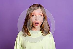 Photo of young girl amazed shock surprised omg wow reaction stupor information isolated over purple color background