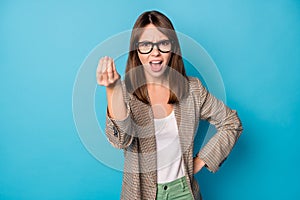 Photo of young girl angry mad conflict accuse blame shout irritated isolated over blue color background