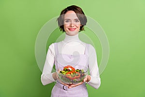 Photo of young girl happy positive smile diet healthy food calories salad lunch isolated over green color background
