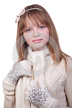 Photo of a young girl in white sweater with scarf