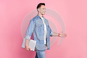 Photo of young good mood businessman entrepreneur go walk with laptop in hands isolated on pink color background