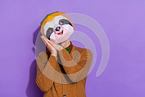 Photo of young guy good mood arms touch cheeks admire rest dream drowse isolated over violet color background