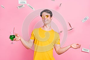 Photo of young guy happy positive smile drink cocktail fly air fall money cash dollars rich isolated over pastel color