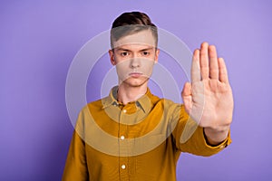 Photo of young guy show hand no stop refuse rejection symbol block enough isolated over violet color background