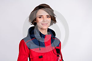 Photo of young happy beautiful cute lovely woman paramedic in uniform smiling isolated on grey color background