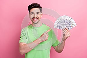 Photo of young happy millionaire man point finger winnings national lottery celebrate big jackpot isolated on pink color photo