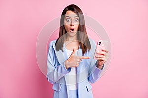 Photo of young lady amazed shocked surprised point finger cellphone mobile advert  over pastel color background