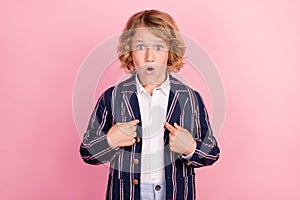 Photo of young little boy amazed shocked stupor point fingers himself isolated over pastel color background