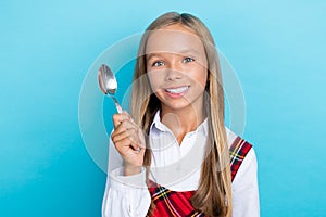Photo of young little cute schoolgirl woman toothy beaming positive hold spoon delivery restaurant isolated on blue