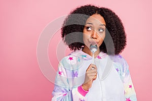 Photo of young lovely african girl starving wondered look empty space isolated over pink color background