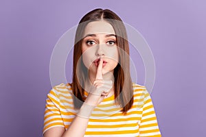 Photo of young lovely girl cover finger lips shh keep secret confidential isolated over violet color background