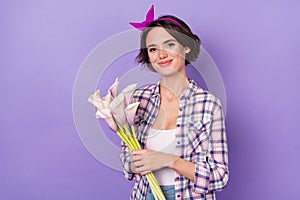 Photo of young lovely girl receive gift flower calla flora plant isolated over purple color background