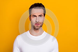 Photo of young man dilemma stupor impressed failure thoughtful isolated over yellow color background