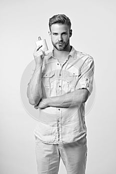 photo of young man with perfumery. man with perfumery. man with perfumery