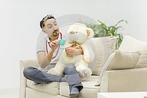 Photo of young man playing game at home.