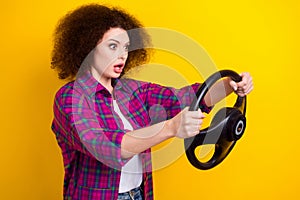 Photo of young nervous girl panic car accident funny driver hold steering wheel fast speed first time on road isolated