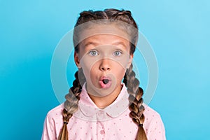 Photo of young preteen girl amazed shocked surprised stupor omg wow isolated over blue color background