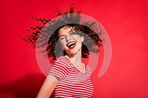 Photo of young pretty girl happy smile curly brown hair wind enjoy shampoo care isolated over red color background