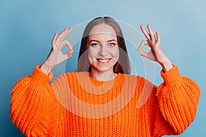 Photo of young pretty lady show fingers advertis okey sign recommendation isolated over blue color background