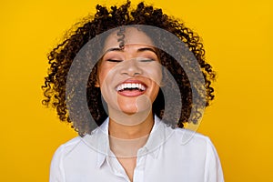 Photo of young pretty stylish cheerful woman with wavy hairdo wear white blouse laughing eyes closed isolated on yellow