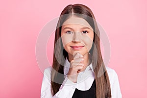 Photo of young school girl happy positive smile hand touch chin think lesson isolated over pink color background