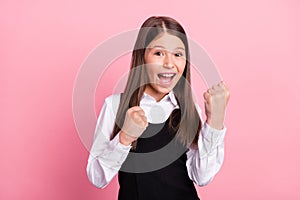 Photo of young school girl happy positive smile rejoice victory success isolated over pink color background