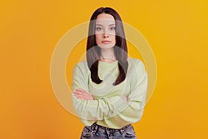 Photo of young serious businees woman crossed hands smart confident isolated yellow color background