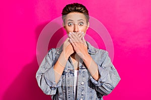 Photo of young shocked amazed scared woman cover hands face mouth guilty sorry isolated on pink color background