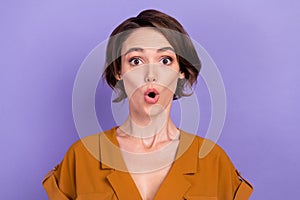 Photo of young woman amazed shocked fake novelty news information gossip isolated over violet color background