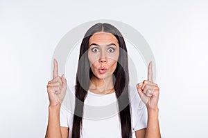 Photo of young woman amazed shocked indicate fingers up sale suggest advert isolated over white color background